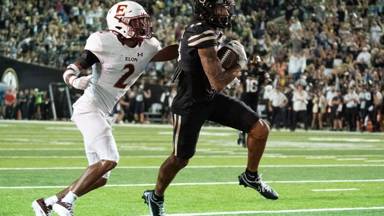 Vanderbilt wide receiver Will Sheppard (14) races past Elon defensive back Tre'Von Jones (2) for a touchdown during the second quarter at FirstBank Stadium Saturday, Sept. 3, 2022, in Nashville, Tenn.

Nas Elon Vanderbilt 017