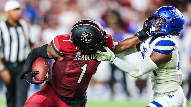 Sep 3, 2022; Columbia, South Carolina, USA; Georgia State Panthers safety Antavious Lane (34) is called for a face masking penalty on South Carolina Gamecocks running back MarShawn Lloyd (1) in the second quarter at Williams-Brice Stadium. Mandatory Credit: Jeff Blake-USA TODAY Sports