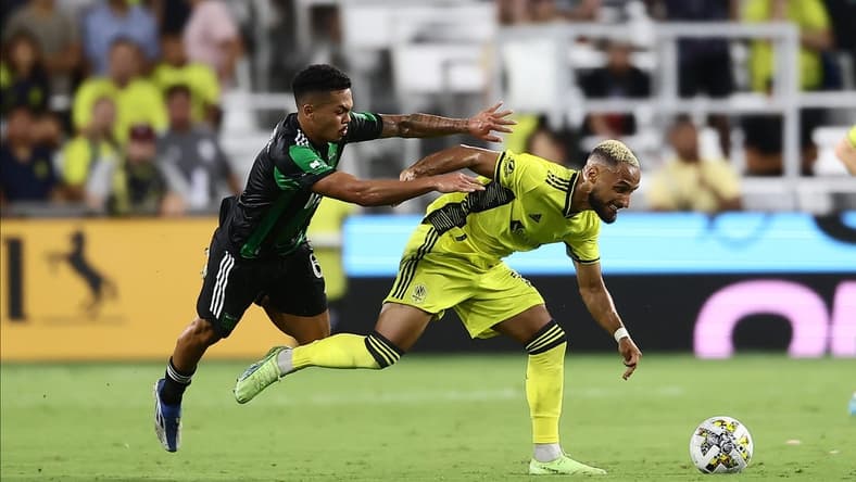 Sep 3, 2022; Nashville, Tennessee, USA;  Nashville SC midfielder Hany Mukhtar (10) gets pushed by Austin FC midfielder Daniel Pereira (6) in the first half at Geodis Park. Mandatory Credit: Casey Gower-USA TODAY Sports