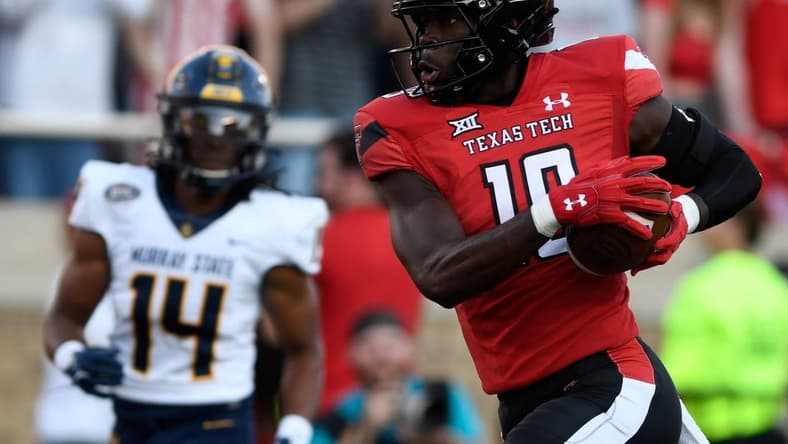Texas Tech's wide receiver Loic Fouonji (19) runs for a touchdown against Murray State, Saturday, Sept. 3, 2022, at Jones AT&T Stadium.