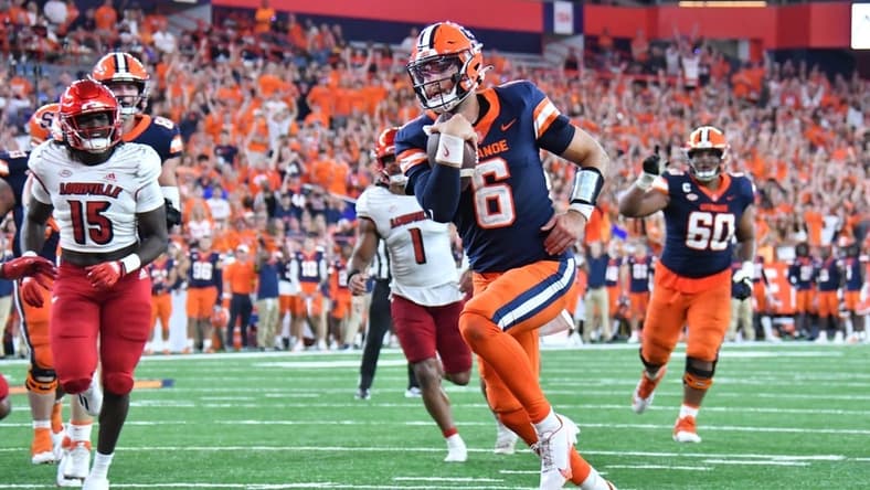 Sep 3, 2022; Syracuse, New York, USA; Syracuse Orange quarterback Garrett Shrader (6) runs for a touchdown against the Louisville Cardinals in the fourth quarter at JMA Wireless Dome. Mandatory Credit: Mark Konezny-USA TODAY Sports