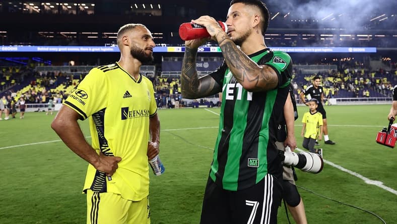 Sep 3, 2022; Nashville, Tennessee, USA; Nashville SC midfielder Hany Mukhtar (10) celebrates his victory with Austin FC forward Sebasti n Driussi (7) after the match at Geodis Park. Mandatory Credit: Casey Gower-USA TODAY Sports