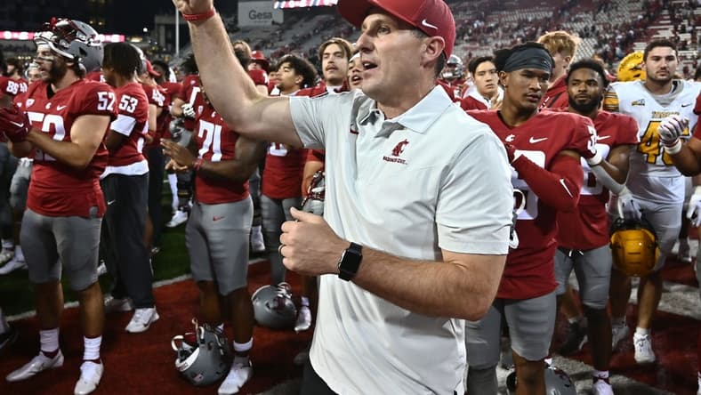 Sep 3, 2022; Pullman, Washington, USA; Washington State Cougars head coach Jake Dickert sings the school fight song after defeating the Idaho Vandals at Gesa Field at Martin Stadium. Washington State won 24-17. Mandatory Credit: James Snook-USA TODAY Sports