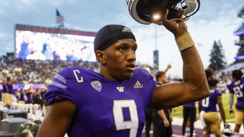 Sep 3, 2022; Seattle, Washington, USA; Washington Huskies quarterback Michael Penix Jr. (9) raises his helmet before kickoff against the Kent State Golden Flashes at Alaska Airlines Field at Husky Stadium. Mandatory Credit: Joe Nicholson-USA TODAY Sports