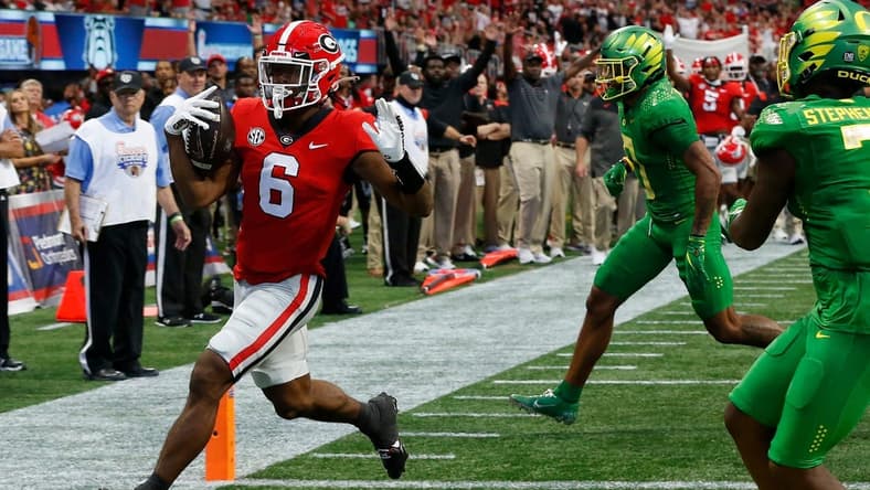 Georgia running back Kenny McIntosh (6) drives in for touchdown during the first half of the Chick-fil-A Kickoff Game between Oregon and Georgia in Atlanta, on Saturday, Sept. 3, 2022.

News Joshua L Jones