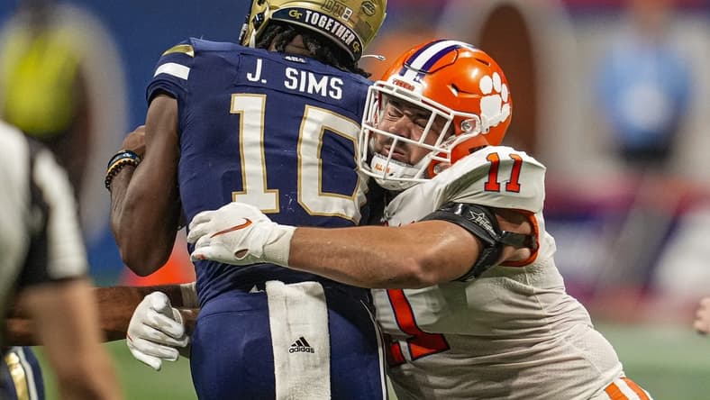 Sep 5, 2022; Atlanta, Georgia, USA; Clemson Tigers defensive tackle Bryan Bresee (11) tackles Georgia Tech Yellow Jackets quarterback Jeff Sims (10) for a loss during the second half at Mercedes-Benz Stadium. Mandatory Credit: Dale Zanine-USA TODAY Sports