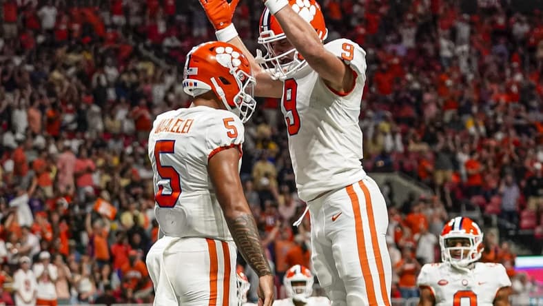 Sep 5, 2022; Atlanta, Georgia, USA; Clemson Tigers quarterback DJ Uiagalelei (5) reacts with tight end Jake Briningstool (9) after running for a touchdown against the Georgia Tech Yellow Jackets during the second half at Mercedes-Benz Stadium. Mandatory Credit: Dale Zanine-USA TODAY Sports