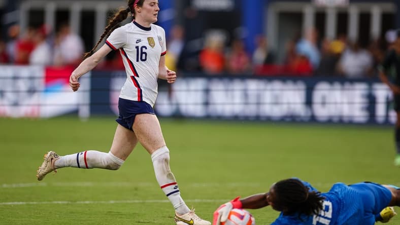 Sep 6, 2022; Washington, District of Columbia, USA; Nigeria goalkeeper Chiamaka Nnadozie (16) makes a save against United States midfielder Rose Lavelle (16) during the first half at Audi Field. Mandatory Credit: Scott Taetsch-USA TODAY Sports