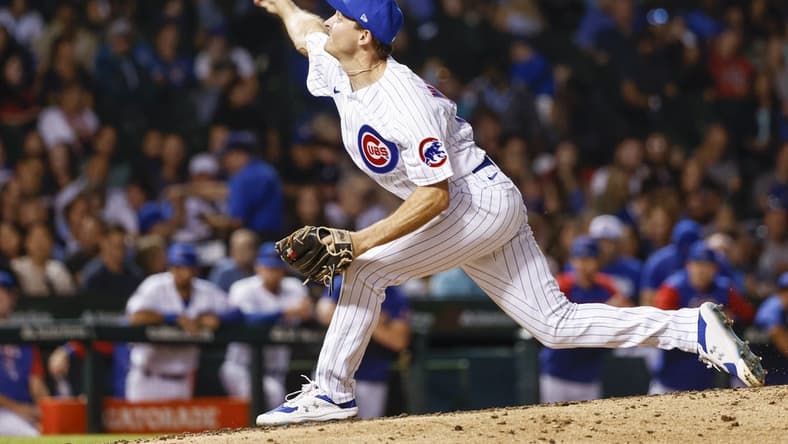Sep 6, 2022; Chicago, Illinois, USA; Chicago Cubs relief pitcher Hayden Wesneski (19) delivers against the Cincinnati Reds during the fifth inning at Wrigley Field. Mandatory Credit: Kamil Krzaczynski-USA TODAY Sports
