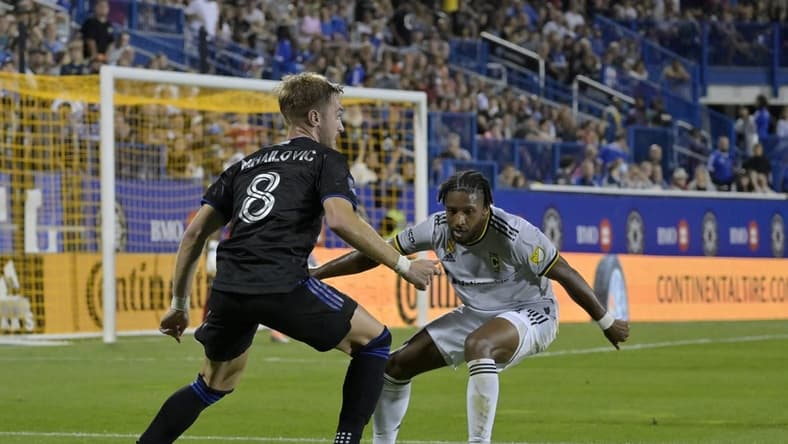 Sep 9, 2022; Montreal, Quebec, CAN; CF Montreal midfielder Djordje Mihailovic (8) plays the ball and Columbus Crew defender Steven Moreira (31) defends during the first half at Stade Saputo. Mandatory Credit: Eric Bolte-USA TODAY Sports