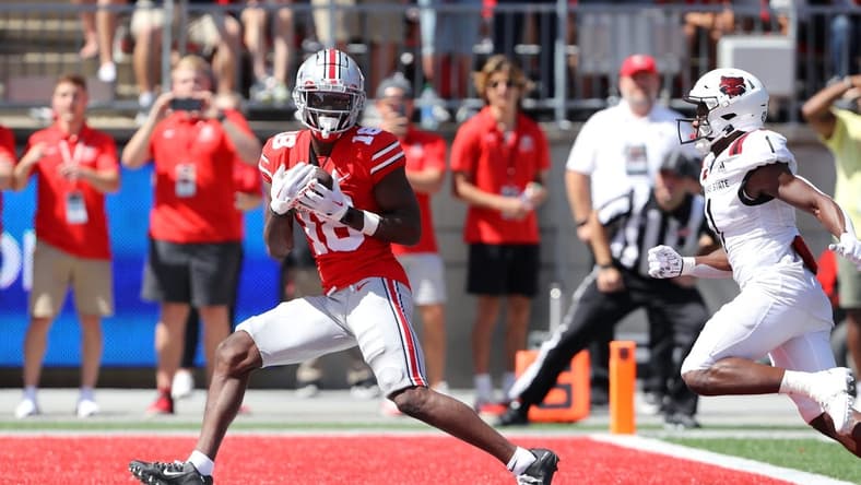 Sep 10, 2022; Columbus, Ohio, USA; Ohio State Buckeyes wide receiver Marvin Harrison Jr. (18) makes the touchdown catch during the second quarter against the Arkansas State Red Wolves at Ohio Stadium. Mandatory Credit: Joseph Maiorana-USA TODAY Sports