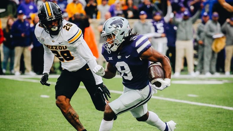 Kansas State's Phillip Brooks runs away from Missouri's Joseph Charleston (28) during Missouri's game against Kansas State at Bill Snyder Family Stadium in Manhattan, Kansas, on Sept. 10, 2022.