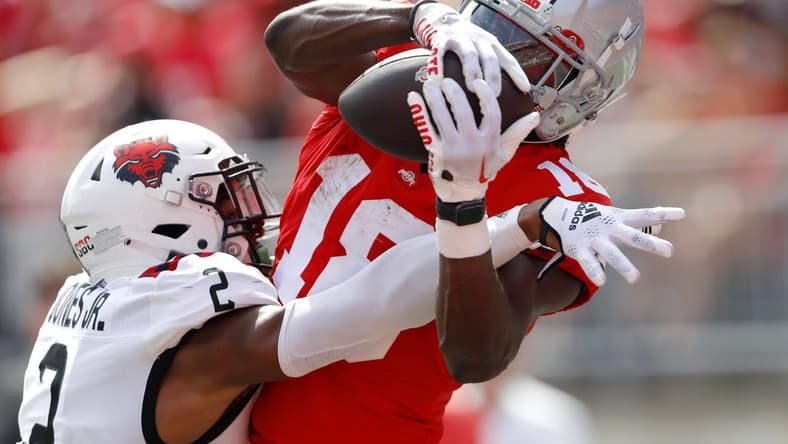 Sep 10, 2022; Columbus, Ohio, USA;  Ohio State Buckeyes wide receiver Marvin Harrison Jr. (18) makes the touchdown catch over Arkansas State Red Wolves cornerback Leon Jones (2) during the second half at Ohio Stadium. Mandatory Credit: Joseph Maiorana-USA TODAY Sports