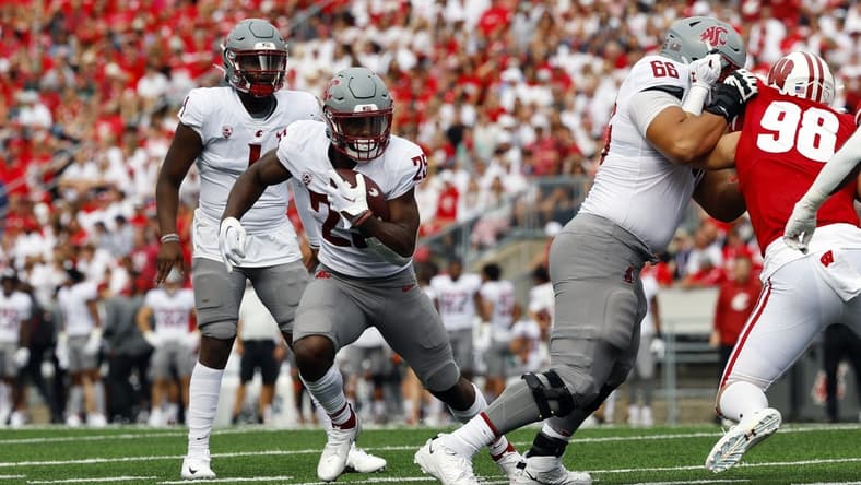 Sep 10, 2022; Madison, Wisconsin, USA;  Washington State Cougars running back Nakia Watson (25) rushes with the football during the second quarter against the Wisconsin Badgers at Camp Randall Stadium. Mandatory Credit: Jeff Hanisch-USA TODAY Sports