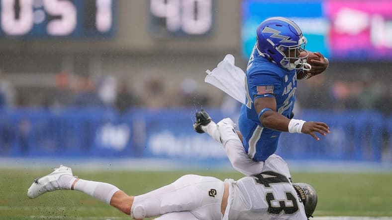Sep 10, 2022; Colorado Springs, Colorado, USA; Air Force Falcons running back John Lee Eldridge III (24) is tackled by Colorado Buffaloes safety Trevor Woods (43) in the first quarter at Falcon Stadium. Mandatory Credit: Isaiah J. Downing-USA TODAY Sports