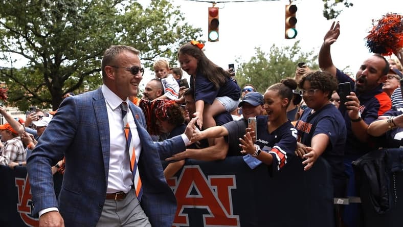 Sep 10, 2022; Auburn, Alabama, USA;  Auburn Tigers head coach Bryan Harsin greets fans during Tiger Walk with the team before the game against the San Jose State Spartans at Jordan-Hare Stadium. Mandatory Credit: John Reed-USA TODAY Sports