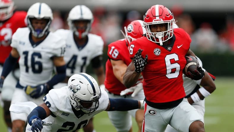 Georgia running back Kenny McIntosh (6) moves the ball down the field during the first half of a NCAA college football game between Samford and Georgia in Athens, Ga., on Saturday, Sept. 10, 2022.

News Joshua L Jones