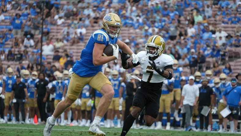 Sep 10, 2022; Pasadena, California, USA; UCLA Bruins tight end Hudson Habermehl (81) is pursued by Alabama State Hornets defensive back Jeffrey Scott Jr. (7) on a touchdown reception in the first half at Rose Bowl. Mandatory Credit: Kirby Lee-USA TODAY Sports
