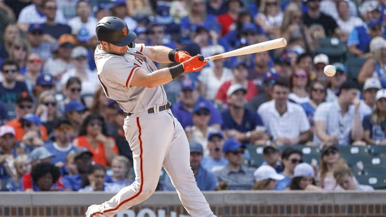 Sep 10, 2022; Chicago, Illinois, USA; San Francisco Giants catcher Joey Bart (21) singles against the Chicago Cubs during the ninth inning at Wrigley Field. Mandatory Credit: Kamil Krzaczynski-USA TODAY Sports
