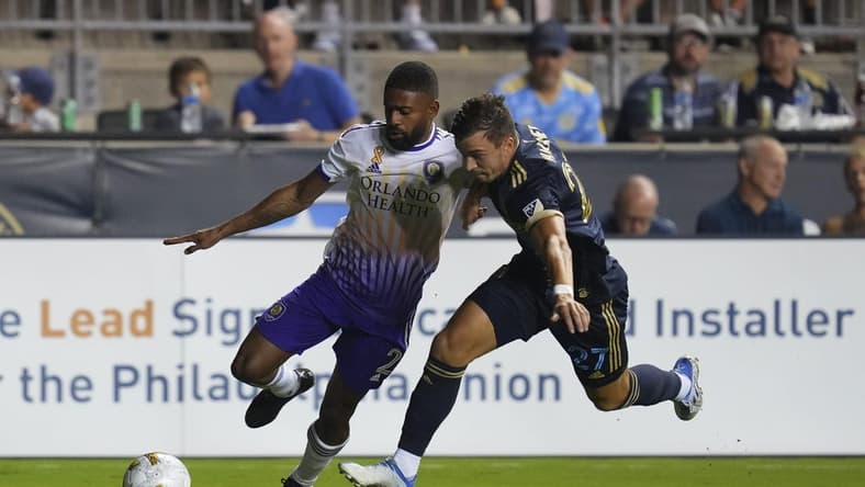 Sep 10, 2022; Chester, Pennsylvania, USA; Orlando City defender Ruan (2) controls the ball against Philadelphia Union defender Kai Wagner (27) in the first half at Subaru Park. Mandatory Credit: Mitchell Leff-USA TODAY Sports