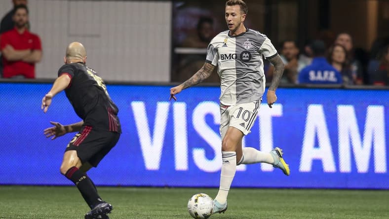 Sep 10, 2022; Atlanta, Georgia, USA; Toronto FC forward Federico Bernardeschi (10) controls the ball against Atlanta United defender Andrew Gutman (15) in the first half at Mercedes-Benz Stadium. Mandatory Credit: Brett Davis-USA TODAY Sports
