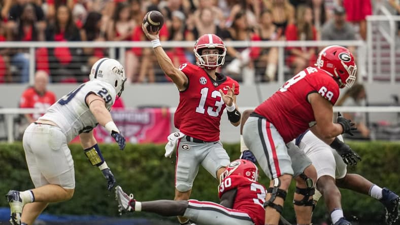 Sep 10, 2022; Athens, Georgia, USA; Georgia Bulldogs quarterback Stetson Bennett (13) passes against the Samford Bulldogs during the second half at Sanford Stadium. Mandatory Credit: Dale Zanine-USA TODAY Sports