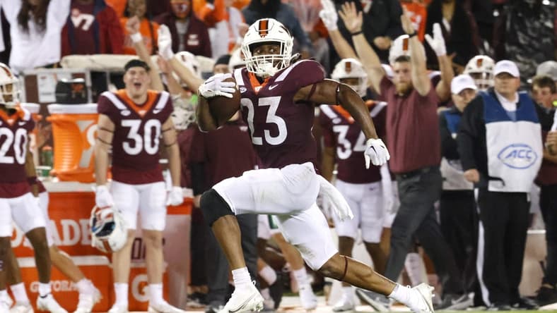 Sep 10, 2022; Blacksburg, Virginia, USA;  Virginia Tech Hokies running back Keshawn King (23) runs for a touchdown during the second quarter against the Boston College Eagles at Lane Stadium. Mandatory Credit: Reinhold Matay-USA TODAY Sports