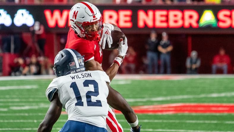 Sep 10, 2022; Lincoln, Nebraska, USA; Nebraska Cornhuskers wide receiver Marcus Washington (7) catches a pass against Georgia Southern Eagles defensive back Anthony Wilson (12) during the second quarter at Memorial Stadium. Mandatory Credit: Dylan Widger-USA TODAY Sports