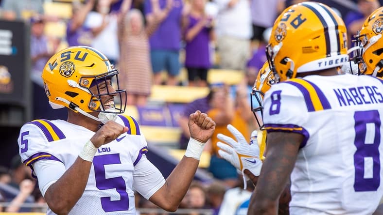 Sep 10, 2022; Baton Rouge, Louisiana, USA; LSU Tigers quarterback Jayden Daniels (5) celebrates after scoring a touchdown against the Southern Jaguars at Tiger Stadium. Mandatory Credit: Scott Clause-USA TODAY Sports