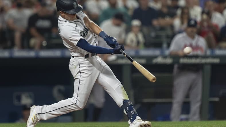 Sep 10, 2022; Seattle, Washington, USA; Seattle Mariners leftfielder Sam Haggerty (0) hits a solo home run off Atlanta Braves starting pitcher Max Fried (54) during the fifth inning at T-Mobile Park. Mandatory Credit: Stephen Brashear-USA TODAY Sports