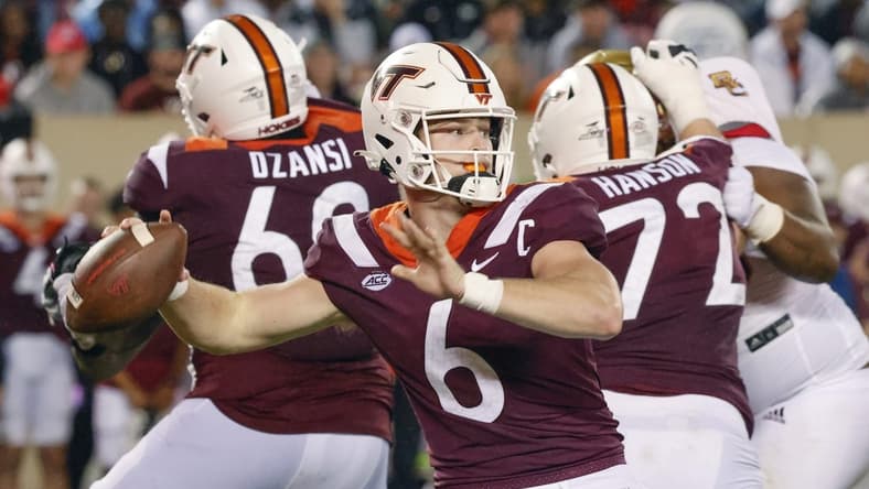 Sep 10, 2022; Blacksburg, Virginia, USA;  Virginia Tech Hokies quarterback Grant Wells (6) throws a pass as Virginia Tech Hokies offensive lineman Jesse Hanson (72) and  offensive lineman Silas Dzansi (60) block during the second half against the Boston College Eagles at Lane Stadium. Mandatory Credit: Reinhold Matay-USA TODAY Sports