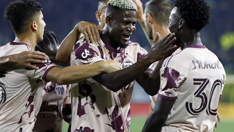 Sep 10, 2022; Portland, Oregon, USA; Portland Timbers forward Dairon Asprilla (27) celebrates with teammates after scoring a goal during the second half against the Minnesota United at Providence Park. Mandatory Credit: Soobum Im-USA TODAY Sports