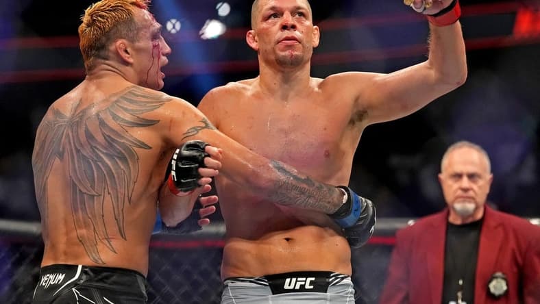 Sep 10, 2022; Las Vegas, Nevada, USA; Nate Diaz (red gloves) fights Tony Ferguson (blue gloves) during UFC 279 at T-Mobile Arena. Mandatory Credit: Joe Camporeale-USA TODAY Sports