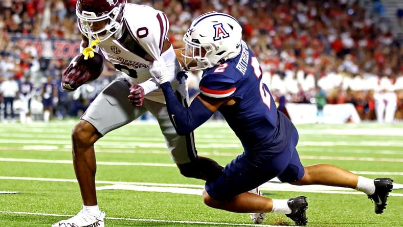 Sep 10, 2022; Tucson, Arizona, USA; Mississippi State Bulldogs wide receiver Rara Thomas (0) runs the ball against Arizona Wildcats cornerback Isaiah Rutherford (2) during the first half at Arizona Stadium. Mandatory Credit: Mark J. Rebilas-USA TODAY Sports
