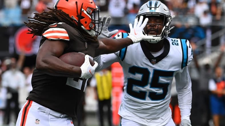 Sep 11, 2022; Charlotte, North Carolina, USA; Carolina Panthers safety Marquise Blair (27) runs for a touchdown   as Carolina Panthers Xavier Woods (25) defends in the second quarter at Bank of America Stadium. Mandatory Credit: Bob Donnan-USA TODAY Sports