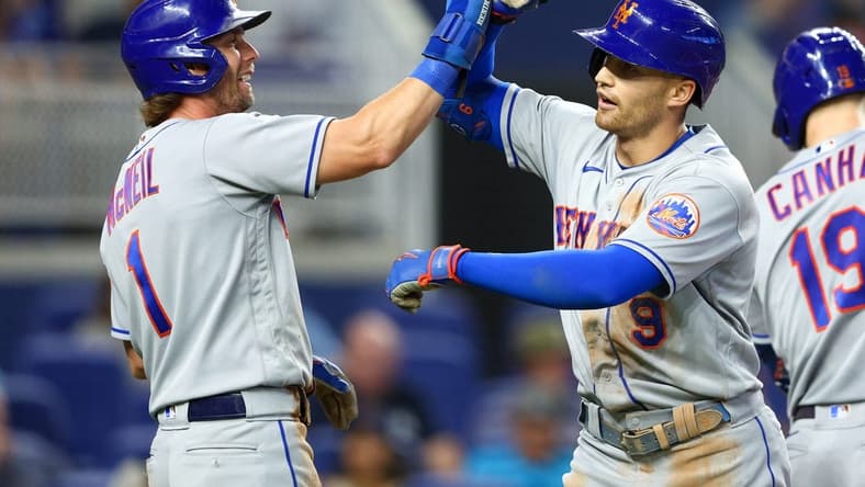 Sep 11, 2022; Miami, Florida, USA; New York Mets second baseman Jeff McNeil (1) congratulates center fielder Brandon Nimmo (9) after hitting a three-ru home run against the Miami Marlins in the second inning at loanDepot Park. Mandatory Credit: Nathan Ray Seebeck-USA TODAY Sports