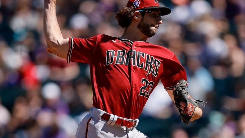 Sep 11, 2022; Denver, Colorado, USA; Arizona Diamondbacks starting pitcher Zac Gallen (23) pitches in the first inning against the Colorado Rockies at Coors Field. Mandatory Credit: Isaiah J. Downing-USA TODAY Sports