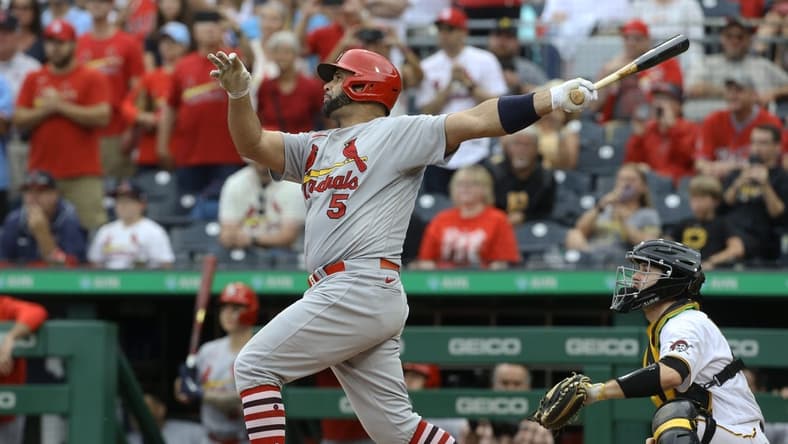 Sep 11, 2022; Pittsburgh, Pennsylvania, USA; St. Louis Cardinals first baseman Albert Pujols (5) hits a two-run home run against the Pittsburgh Pirates during the ninth inning at PNC Park. The home run is the 697th home run of Pujols' career giving him sole possession of fourth place all time on the MLB career home run list. The Cardinals won 4-3. Mandatory Credit: Charles LeClaire-USA TODAY Sports