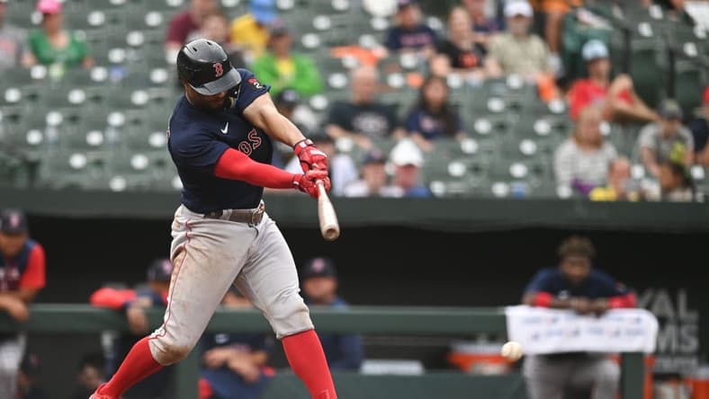 Sep 11, 2022; Baltimore, Maryland, USA; Boston Red Sox shortstop Xander Bogaerts (2) hits a ninth inning single against the Baltimore Orioles  at Oriole Park at Camden Yards. Mandatory Credit: Tommy Gilligan-USA TODAY Sports
