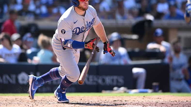 Sep 11, 2022; San Diego, California, USA; Los Angeles Dodgers designated hitter Max Muncy (13) hits a two-RBI single against the San Diego Padres during the sixth inning at Petco Park. Mandatory Credit: Orlando Ramirez-USA TODAY Sports