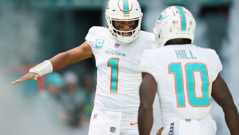 Miami Dolphins quarterback Tua Tagovailoa (1) and wide receiver Tyreek Hill (10) take the field before the opening game of the season against the New England Patriots at Hard Rock Stadium in Miami Gardens, Sept. 11, 2022.
Dolphins V Patriots Nfl Game 15