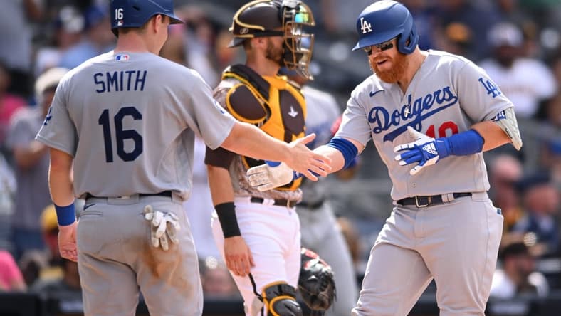 Sep 11, 2022; San Diego, California, USA; Los Angeles Dodgers third baseman Justin Turner (right) is congratulated by designated hitter Will Smith (16) after hitting a grand slam home run against the San Diego Padres during the seventh inning at Petco Park. Mandatory Credit: Orlando Ramirez-USA TODAY Sports