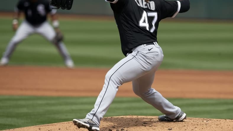 Sep 11, 2022; Oakland, California, USA; Chicago White Sox starting pitcher Johnny Cueto (47) delivers a pitch against the Oakland Athletics during the first inning at RingCentral Coliseum. Mandatory Credit: D. Ross Cameron-USA TODAY Sports