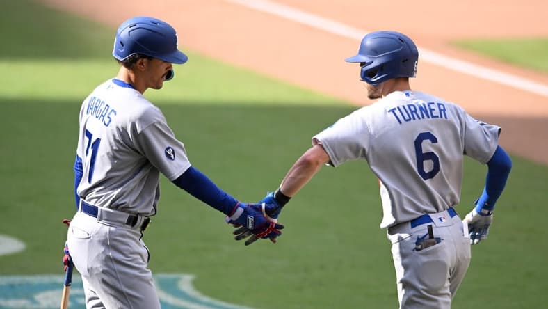Sep 11, 2022; San Diego, California, USA; Los Angeles Dodgers shortstop Trea Turner (6) is congratulated by first baseman Miguel Vargas (71) after hitting a home run against the San Diego Padres during the ninth inning at Petco Park. Mandatory Credit: Orlando Ramirez-USA TODAY Sports