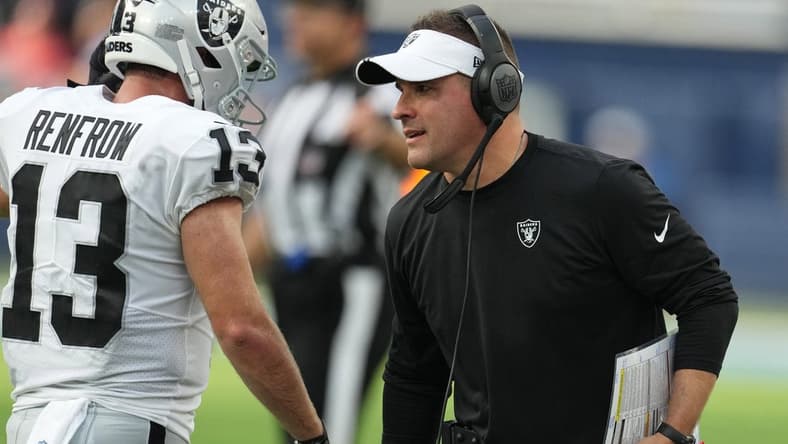 Sep 11, 2022; Inglewood, California, USA; Las Vegas Raiders coach Josh McDaniels (right) and wide receiver Hunter Renfrow (13) react in the second half against the Los Angeles Chargers at SoFi Stadium. Mandatory Credit: Kirby Lee-USA TODAY Sports
