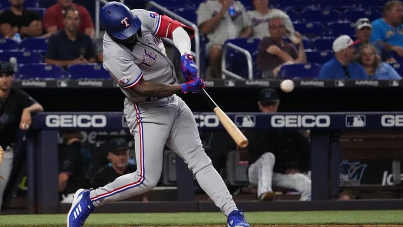 Sep 12, 2022; Miami, Florida, USA; Texas Rangers right fielder Adolis Garcia (53) doubles in the seventh inning against the Miami Marlins at loanDepot park. Mandatory Credit: Jasen Vinlove-USA TODAY Sports