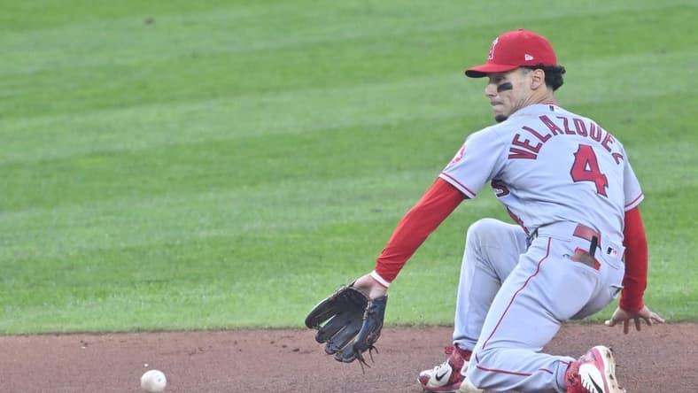 Sep 12, 2022; Cleveland, Ohio, USA; Los Angeles Angels shortstop Andrew Velazquez (4) reaches for the ball in the second inning against the Cleveland Guardians at Progressive Field. Mandatory Credit: David Richard-USA TODAY Sports
