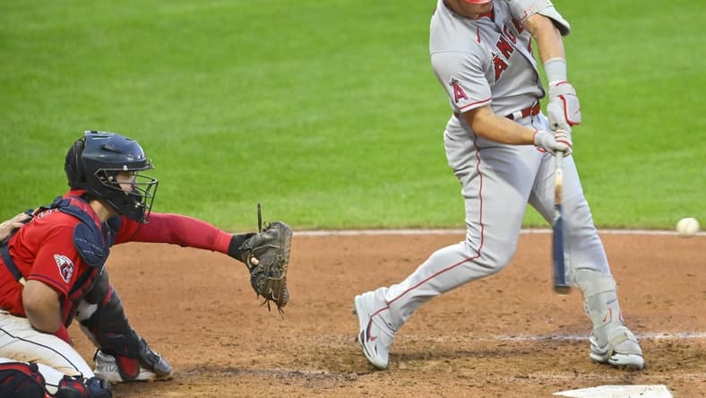 Sep 12, 2022; Cleveland, Ohio, USA; Los Angeles Angels center fielder Mike Trout (27) hits a two-run home run in the fifth inning against the Cleveland Guardians at Progressive Field. Mandatory Credit: David Richard-USA TODAY Sports