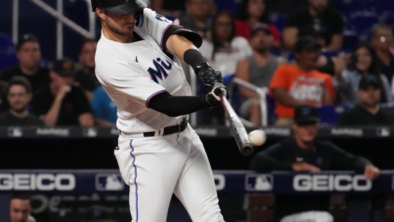 Sep 12, 2022; Miami, Florida, USA; Miami Marlins second baseman Charles Leblanc (83) doubles in a run in the fifth inning against the Texas Rangers at loanDepot park. Mandatory Credit: Jasen Vinlove-USA TODAY Sports