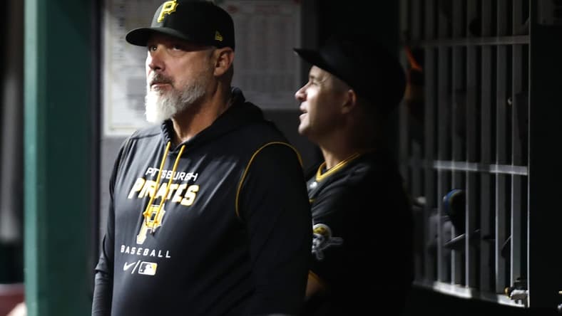 Sep 12, 2022; Cincinnati, Ohio, USA; Pittsburgh Pirates manager Derek Shelton (17) watches from the dugout against the Cincinnati Reds during the eighth inning at Great American Ball Park. Mandatory Credit: David Kohl-USA TODAY Sports
